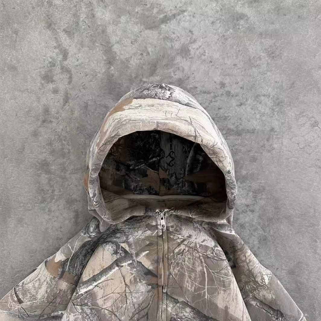 Oversized Urban Camo hoodie in neutral tones with a zip closure and adjustable hood, designed for unisex wear.