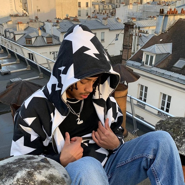 Star Printed Zip Up Hoodie in black and white, worn unzipped over a black t-shirt, featuring a relaxed fit and star pattern.