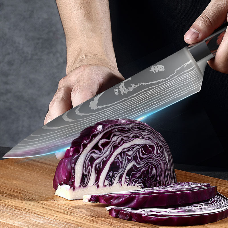 Damascus Style Kitchen Knife slicing red cabbage on a wooden cutting board, showcasing the sharp blade and detailed design.