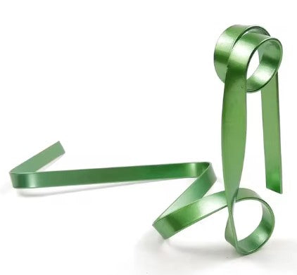 Creative green iron ribbon wine rack with a unique suspended design, elegantly showcasing up to five wine bottles.