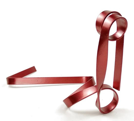 Creative red iron ribbon wine rack with an artistic design, featuring a looped shape to hold wine bottles securely.