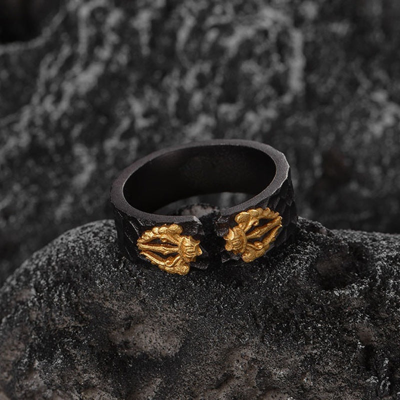 Retro adjustable ring features a matte black alloy base with ornate gold geometric accents, showcasing a vintage design.