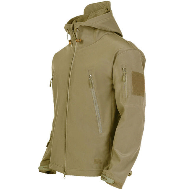 Tactical waterproof jacket in khaki with an adjustable hood and multiple zippered pockets for outdoor adventures.