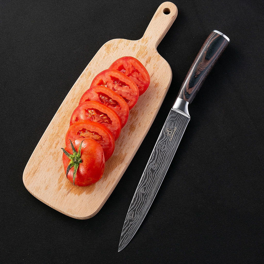 Damascus Style Kitchen Knife beside sliced tomatoes on a wooden cutting board against a black background.