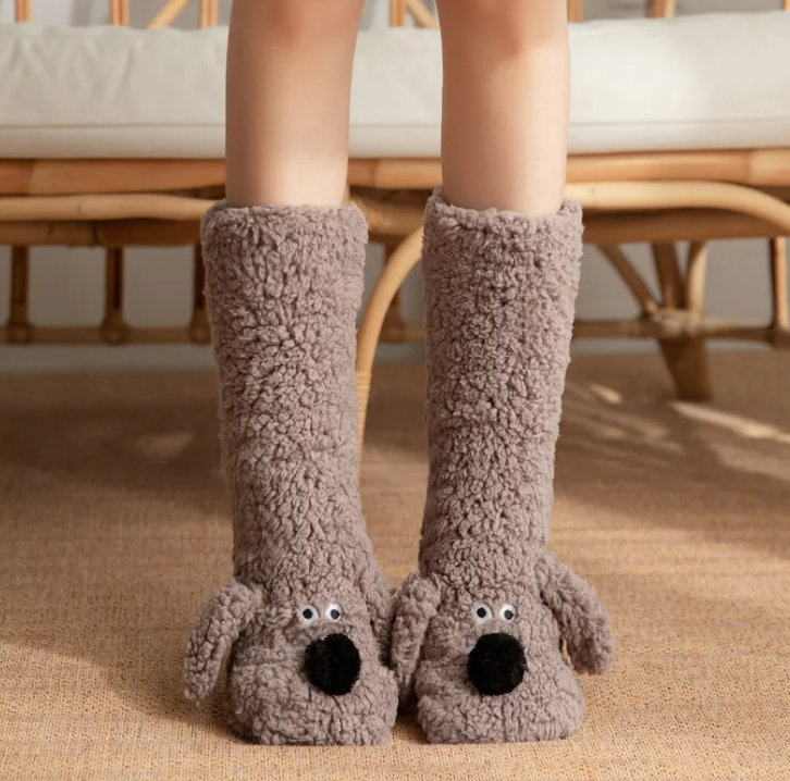 Cozy women's plush dog socks in a soft gray fabric, featuring adorable dog faces and non-slip soles for safety.