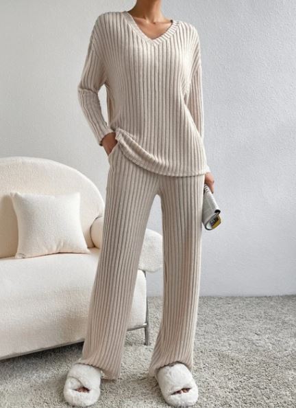 Casual 2-Piece Loungewear Set in light beige features vertical stripes, a relaxed fit top, and matching pants, worn with fluffy slippers.