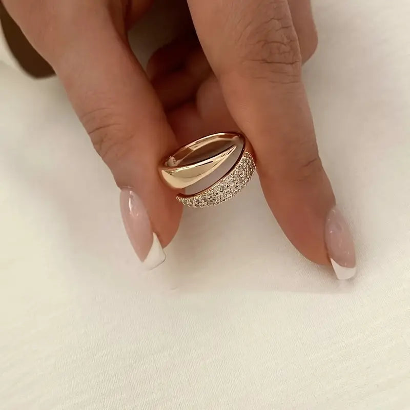 Elegant Adjustable Sparkle Ring with a rose gold band and multiple rows of sparkling stones, shown on a hand with manicured nails.
