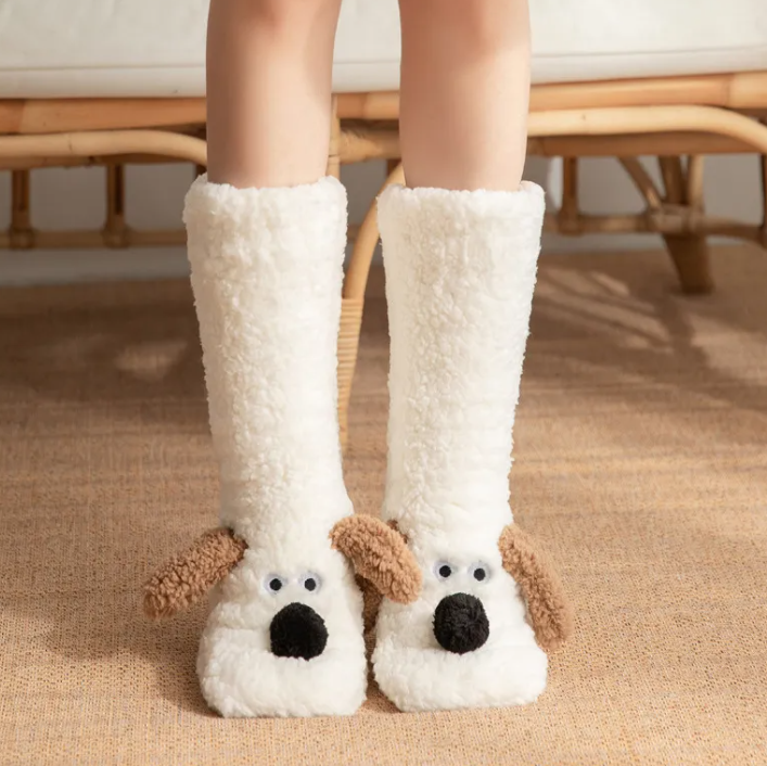Women’s Plush Dog Socks featuring a fluffy white design with doggie face details and non-slip soles for comfort and safety.