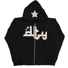Black zip-up hoodie featuring a playful white star print and casual lettering design. Relaxed fit for comfort.