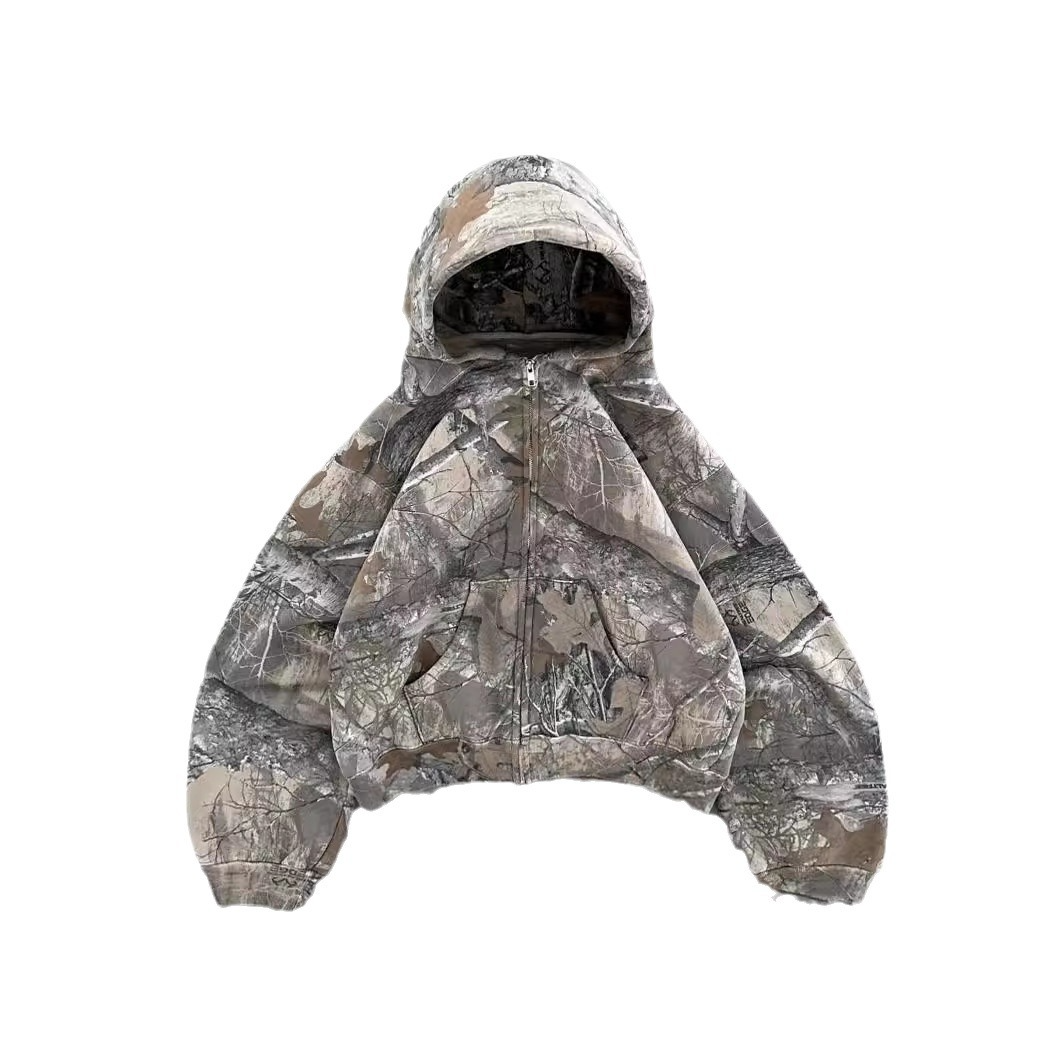 Oversized hoodie in a bold camouflage print with a drawstring hood and relaxed fit for unisex wear.