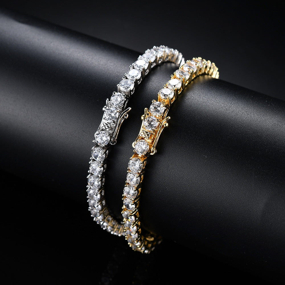 A tennis chain bracelet featuring a single row of clear zircon stones in both gold and silver tones against a dark background.