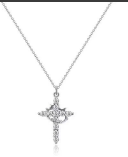 Delicate Y-shaped silver necklace featuring a crown and cross pendant with sparkling details.