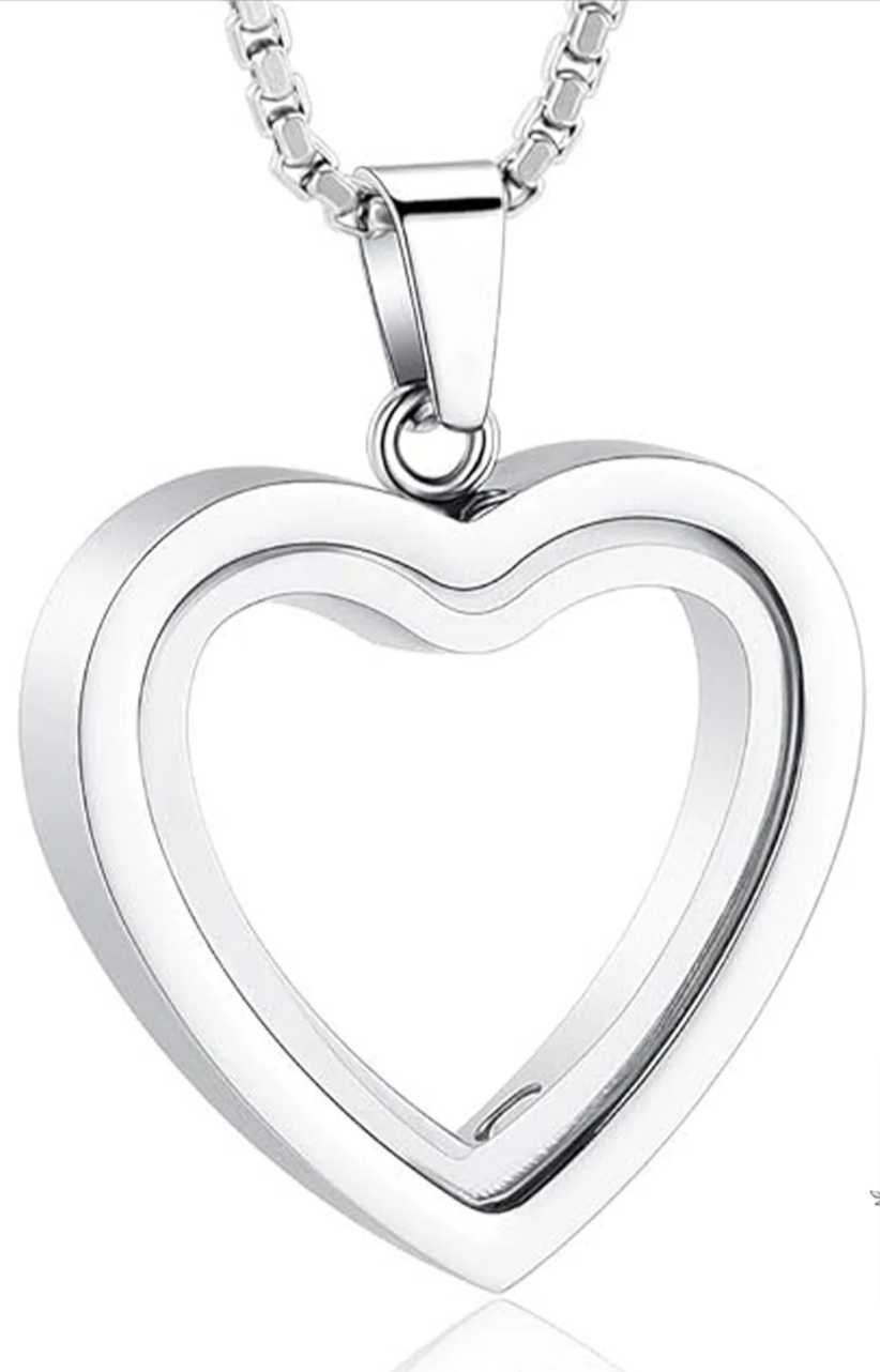 Stainless steel heart-shaped cremation pendant with a polished finish, featuring a thin profile and attached chain.