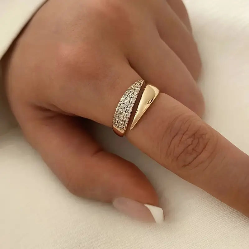 Elegant Adjustable Sparkle Ring featuring multiple rows of sparkling stones in a gold-tone setting, worn on a finger.