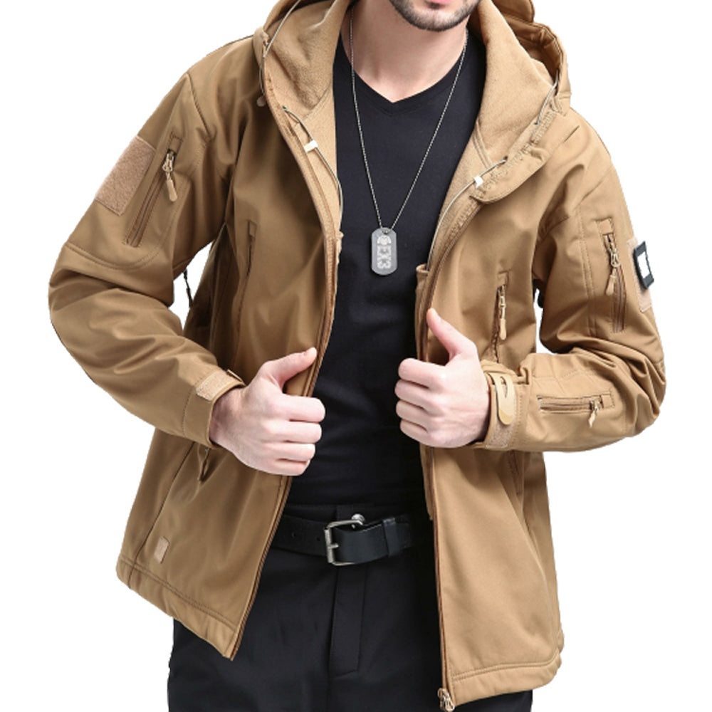Men's tactical jacket in khaki with adjustable hood, multiple pockets, and soft shell material. Model shown wearing it casually.