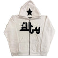 White zip-up hoodie featuring a black star print on the hood and bold graphic design on the front, with two side pockets.