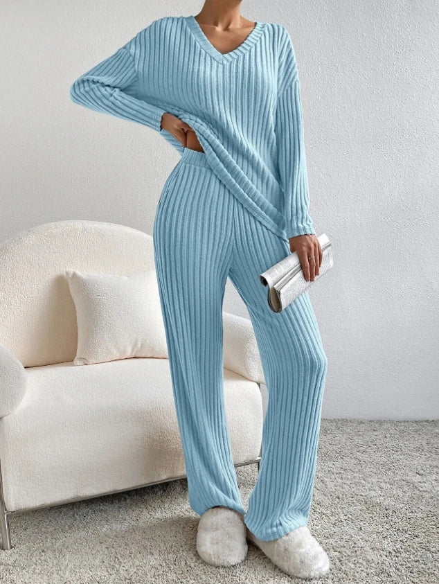Casual 2-piece loungewear set in light blue, featuring a ribbed texture with a V-neck top and relaxed fit pants.
