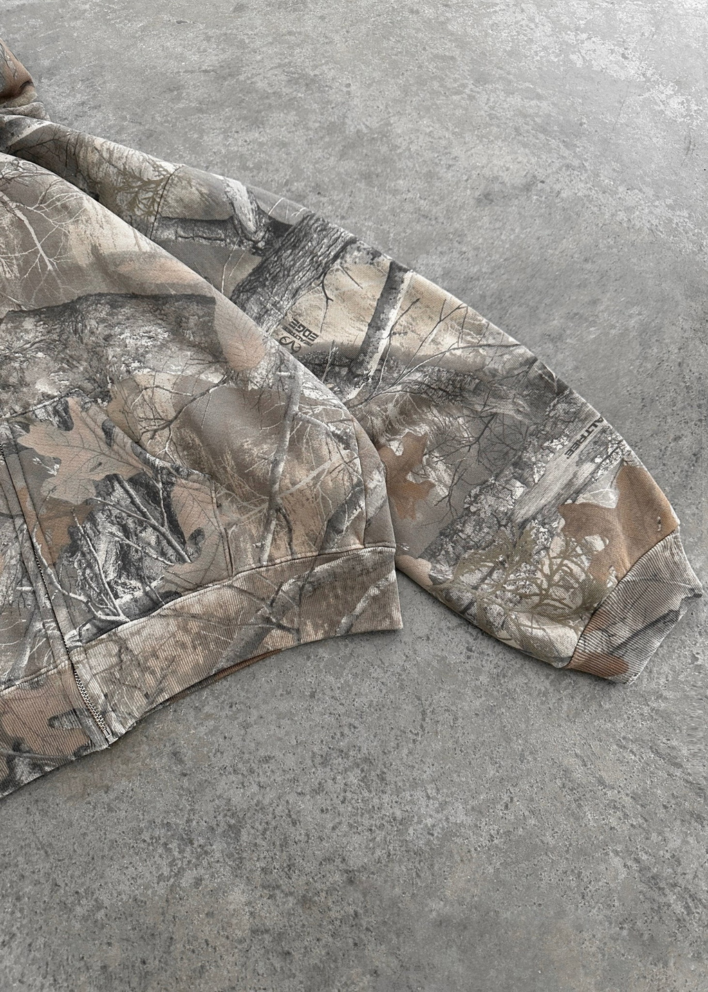 Urban Camo Retro Hoodie in beige and grey camouflage print, featuring oversized fit and ribbed cuffs.