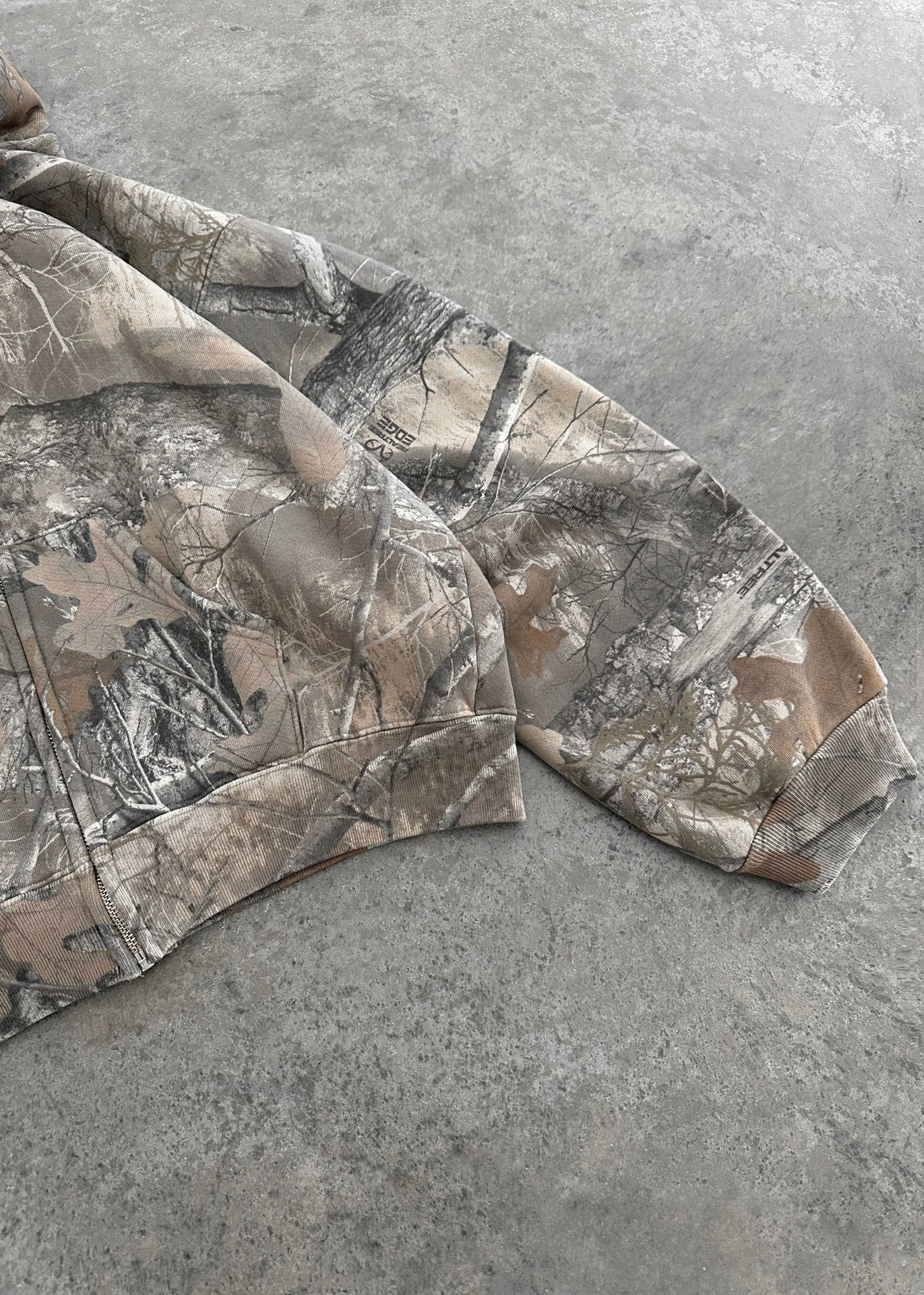 Urban Camo Retro Hoodie in beige and grey camouflage print, featuring oversized fit and ribbed cuffs.
