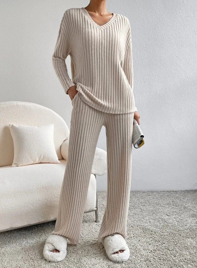 Casual 2-Piece Loungewear Set in beige, featuring ribbed texture, relaxed fit, and V-neck top, paired with matching pants.