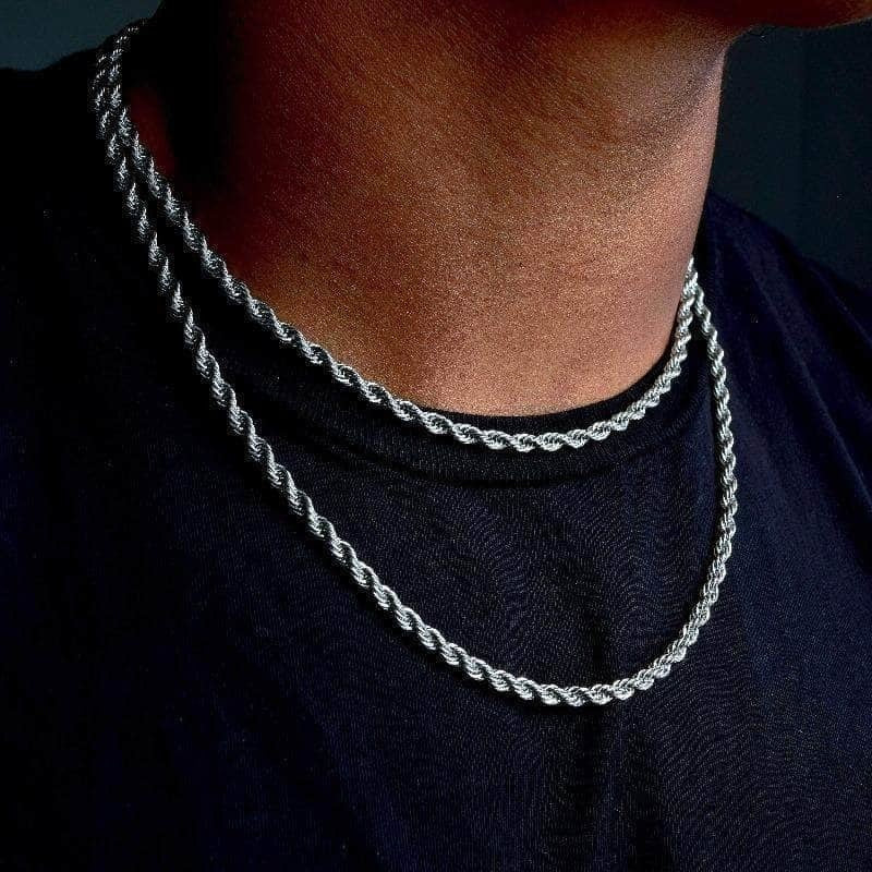 Twisted Rope Figaro Necklaces in shiny stainless steel, layered around the neck against a dark shirt.