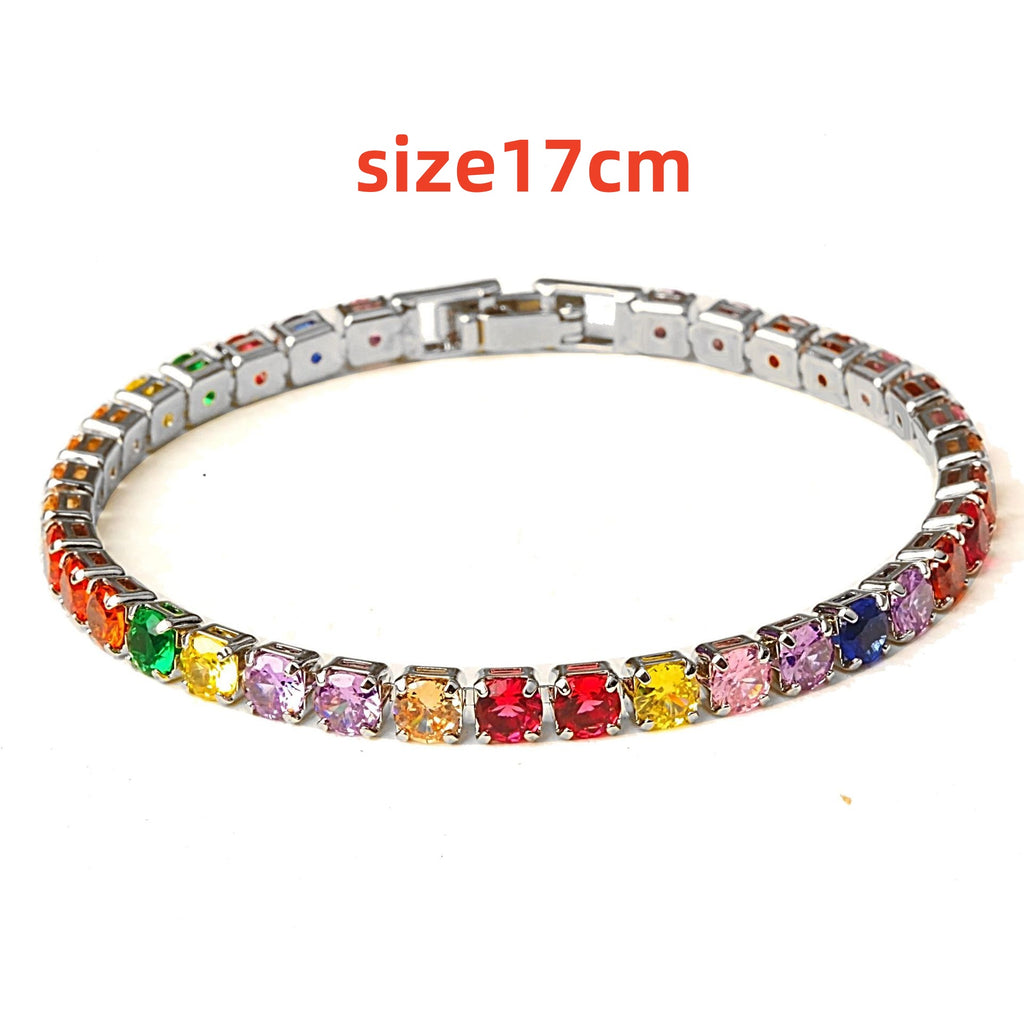 Colorful micro zircon tennis bracelet featuring a silver-tone band and a mix of vibrant gemstones in various hues. Size 17cm.